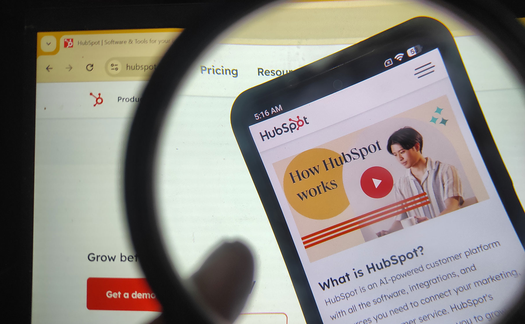 Magnifying glass showing phone on HubSpot blog asking 